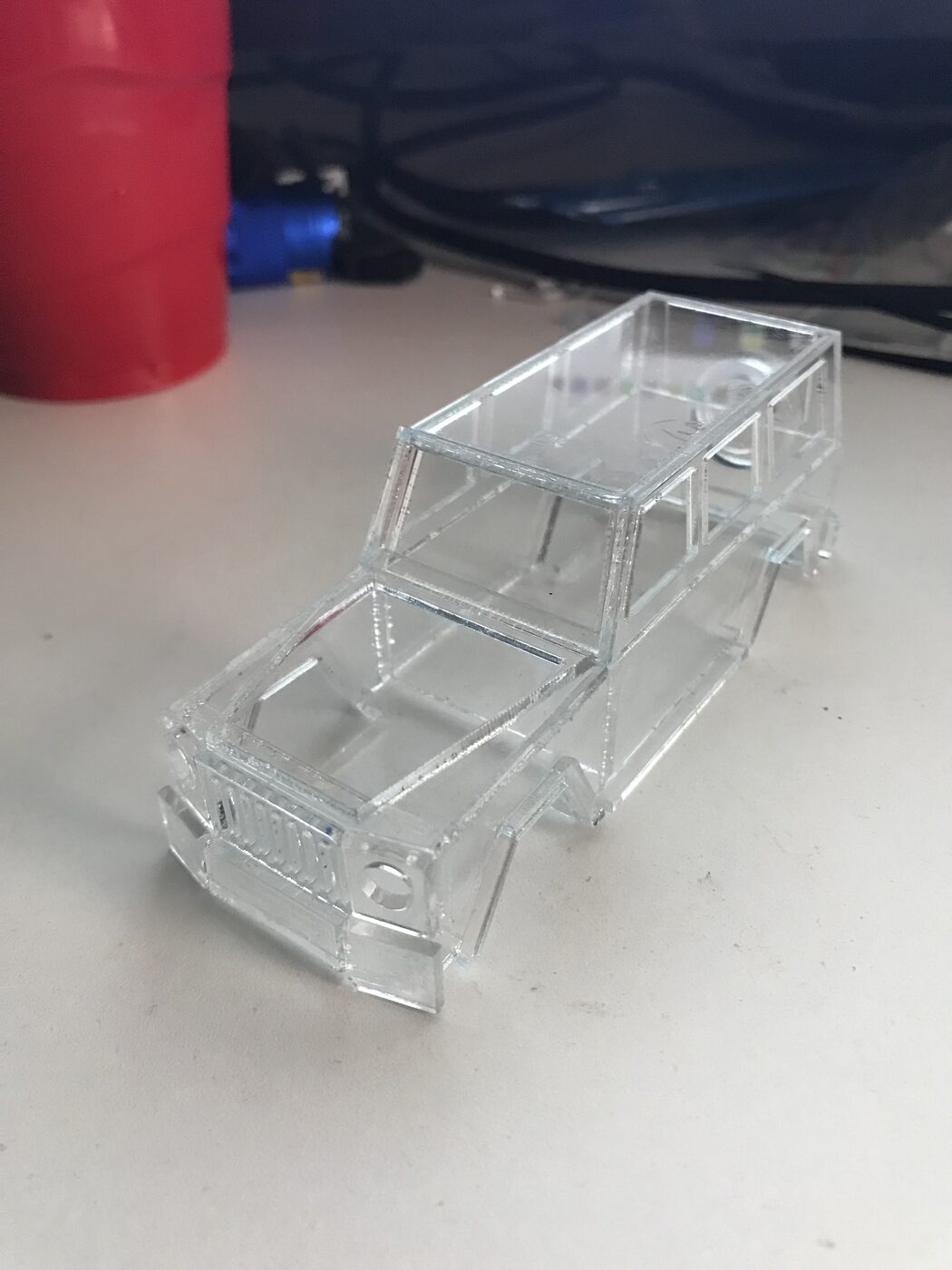 Clear acrylic SUV body on a desk