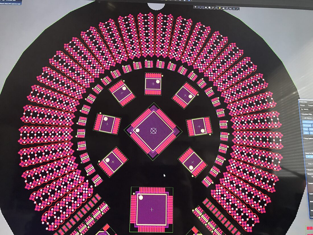 Component footprints in the centre of the board, shown in pink and yellow